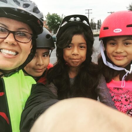 Michele Martinez, far left, taking a selfie with students at the 2015 Bike to School Day in Santa Ana. Photo Courtesy of Michelle Martinez.