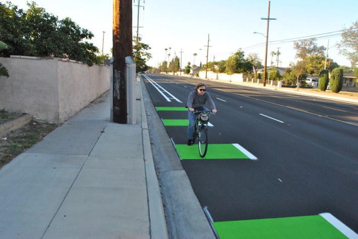 A bicyclist riding southbound on the newly painted New Hope Street bike lane. The roughly one-mile bike lane stretches from West Westminster Avenue to West Fifth Street in Santa Ana.