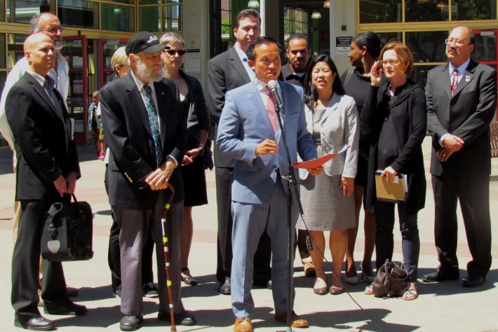 Assemblymember David Chiu proposes a packet of bills to fund transit, flanked by representatives from local transit agencies and advocates. Assemblymember Kevin Mullin is behind him. Photo: Melanie Curry/Streetsblog