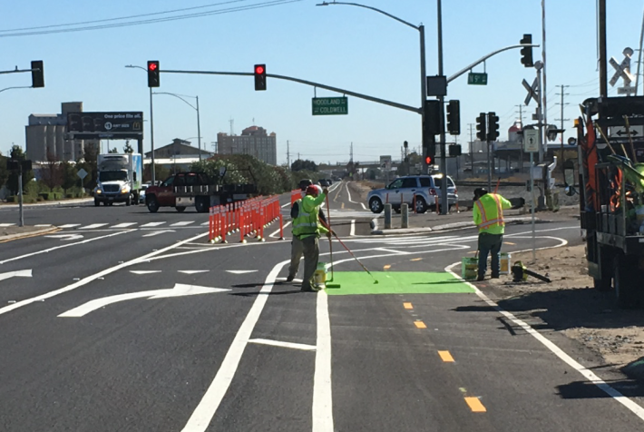 Applying the green on 9th Street at Woodland Avenue.