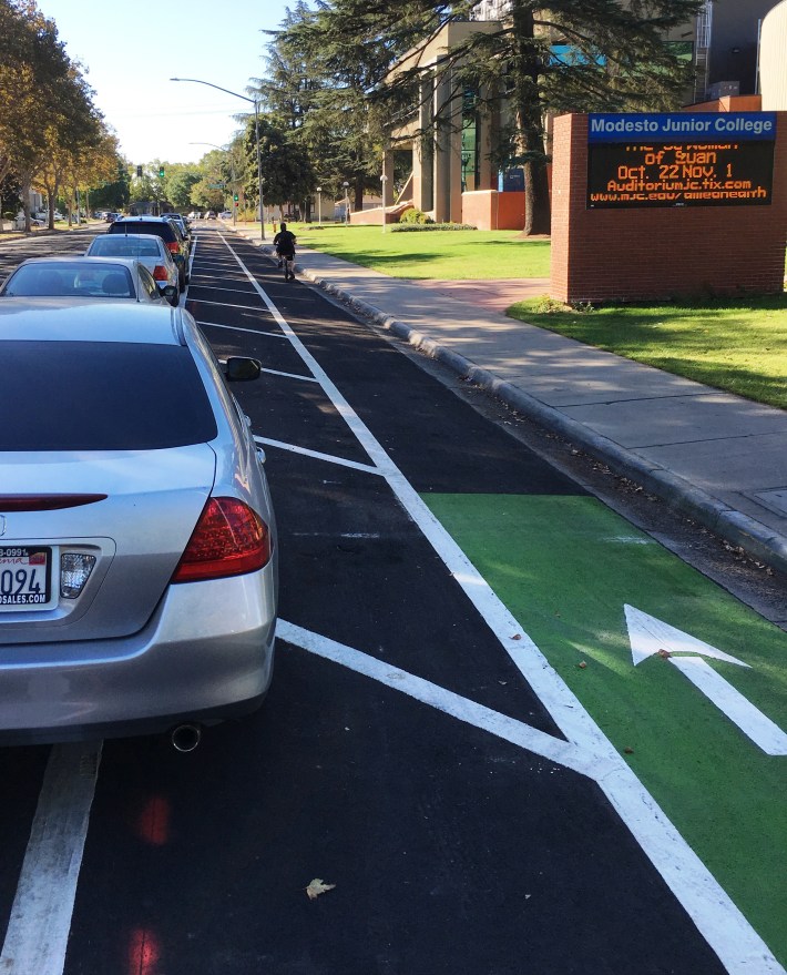 Car drivers are still figuring out how to park along the parking protected lanes.