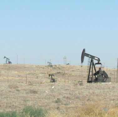 The California Air Resources Board says that the cap-and-trade program is a success. Next year's report will include the transportation and fuels sector. Image: Oil fields near Bakersfield. Melanie Curry.