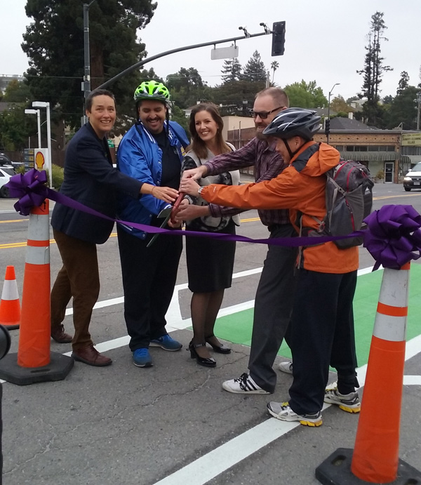Another city, another ribbon to cut: Bike East Bay executive director Renee Rivera, on the left,  joins Oakland City Councilmember Abel Guillen, Oakland Mayor Libby Schaaf, and Piedmont councilmembers Tim Rood and John Chang to officially open bike lanes on Grand Avenue connecting Oakland and PIedmont. Photo: Chris Hwang, WOBO