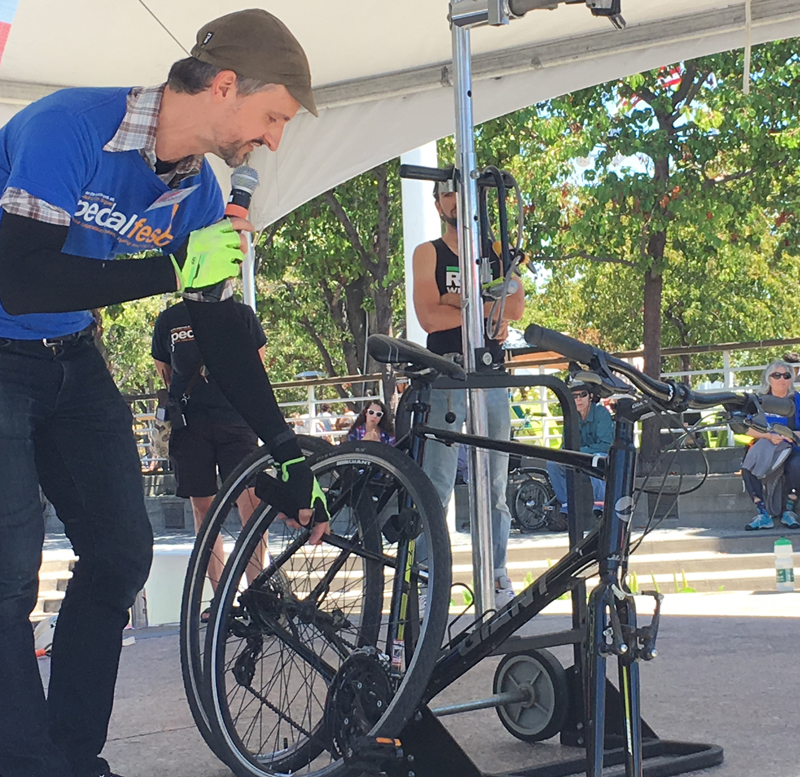 Bike East Bay's Robert Prinz grades a contestant's bike locking skills.