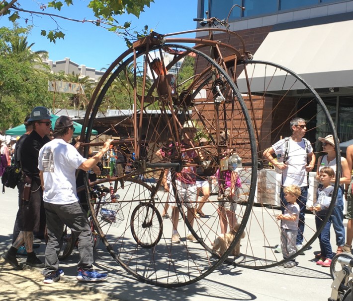 A giant quadricycle penny farthing.