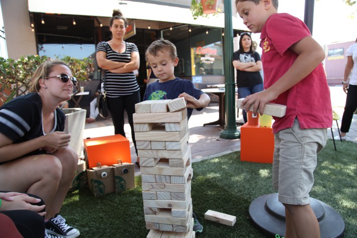 Lynk and Nolan play jenga at Garden Grove's parklet in Downtown Garden Grove. Photo by Kris Fortin