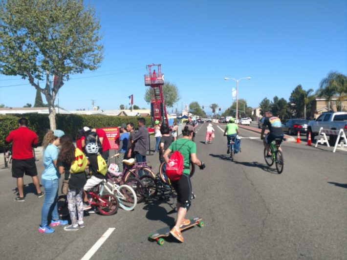 View looking east on Garden Grove Boulevard. Half of the street's travel lanes were closed to car traffic. A midblock traffic median separated the open streets event on the north side of the street from the car traffic on the south side.