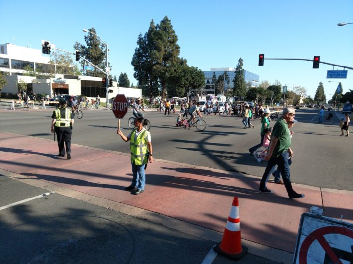 Garden Grove police officers manage traffic at the Euclid St-Acacia Pkwy intersection.