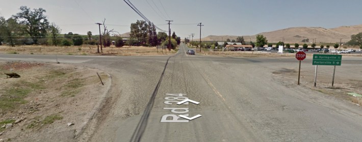 Google street view of the intersection before the roundabout, looking south from Road 284