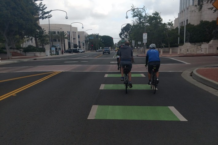 Green-striped bike lane on Ross Street, headed North toward Civic Center Drive.