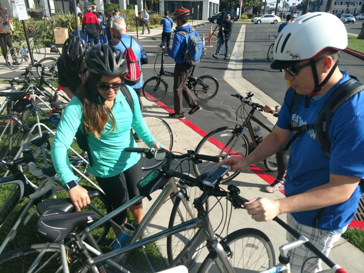 Riders placing their bicycles at the OCTA provided bike valet at the authority's headquarters.