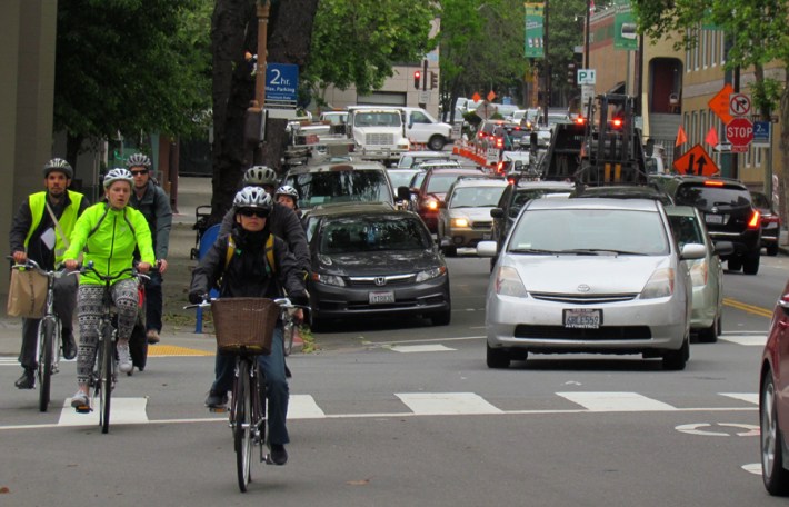 Riders navigate Milvia Street, which is planned to get protected bikeways. Photo: Melanie Curry