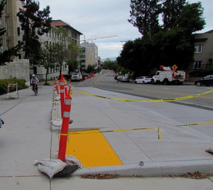 Berkeley is building a raised platform for bus riders, with a bike channel behind it, on Hearst Avenue north of the UC campus. Photo by Melanie Curry