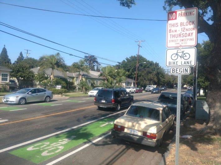 Looking east on Chestnut Avenue, bike lane signage were installed to street signs.