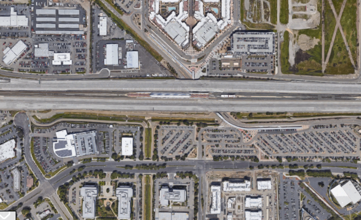 The Dublin/Pleasanton BART station, at center in this image from Google Maps, is in the middle of a freeway and surrounded by seas of parking, which makes getting to it by walking, biking, and bus harder than it should be.