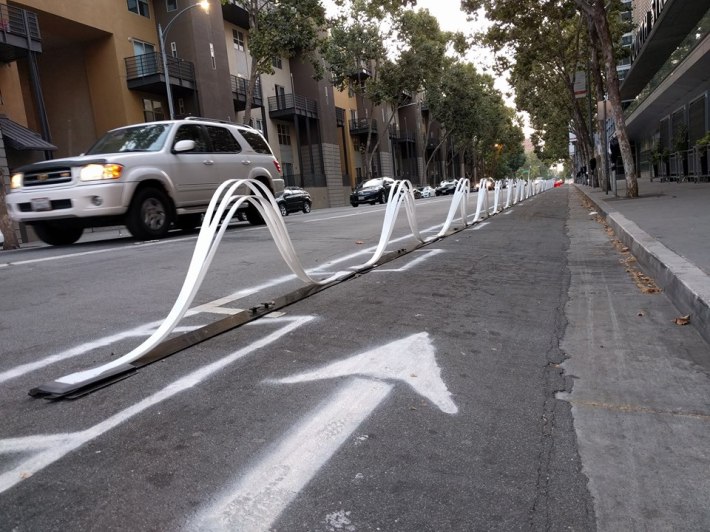 Cool wavy delineators protect part of the pop-up bikeway. Photo courtesy City of San Jose DOT.