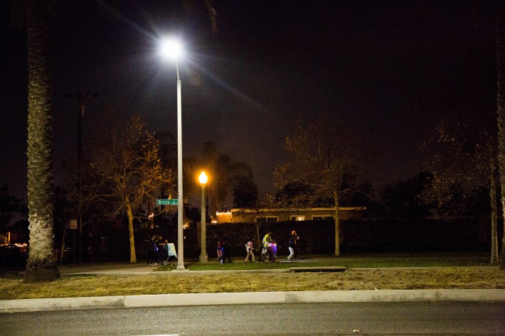 One of the walking groups on Bristol Street during the Walk of Lights. The 45 participants broke up into 3 groups during the walk. Image: Santa Ana Active Streets