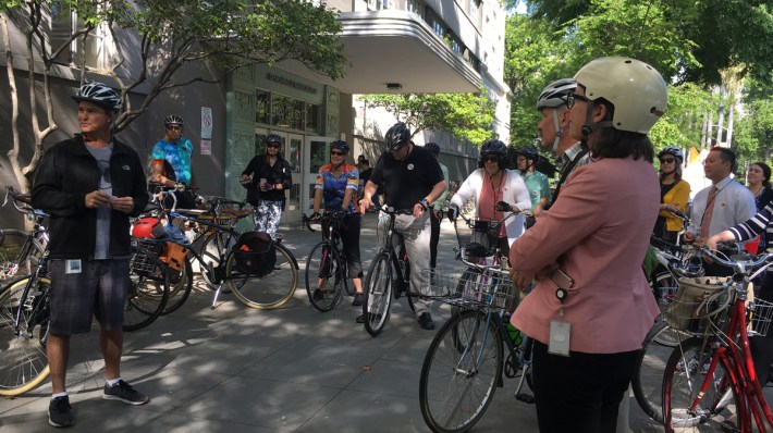 Caltrans Deputy Director Ryan Chamberlain, at left, gathers bike riders for a tour of Sacramento bike facilities.