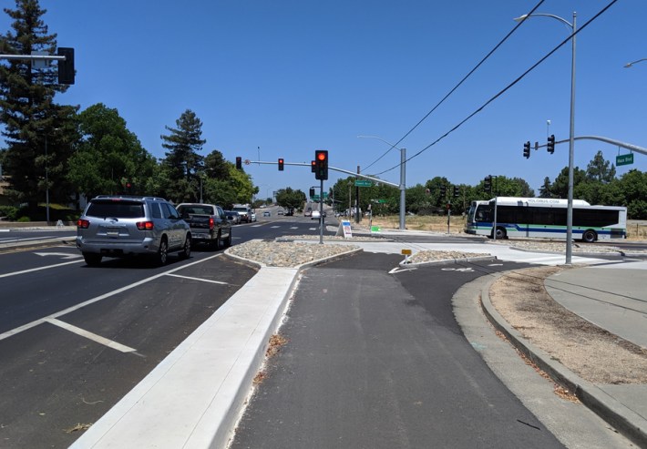 Mace Blvd at Cowell. Old slip lanes have become bikeway; vehicles are forced to take the turn slowly. Photo by Drew Hart