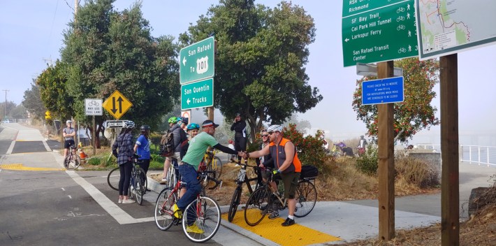 Dave Campbell of Bike East Bay (in green shirt) does outreach on the Marin side of the bridge. Photo by Jason Meggs