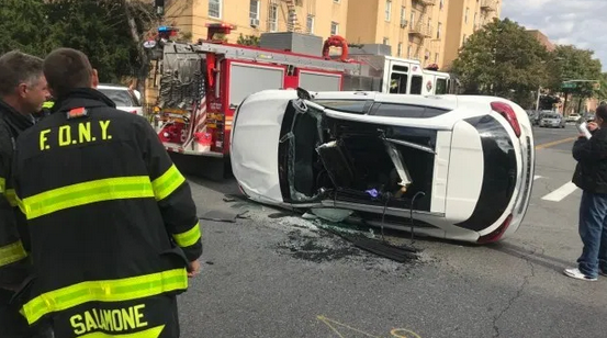 car lies on its side after crash