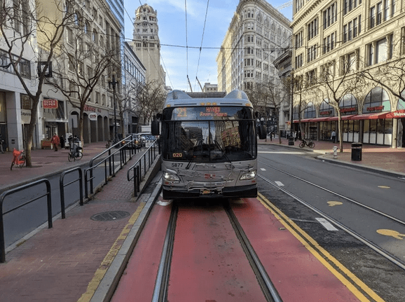 San Francisco Muni electric bus on red transit-only lane