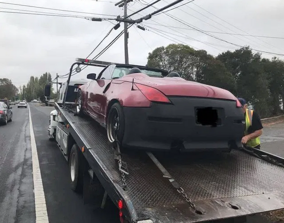 car on flat bed tow truck